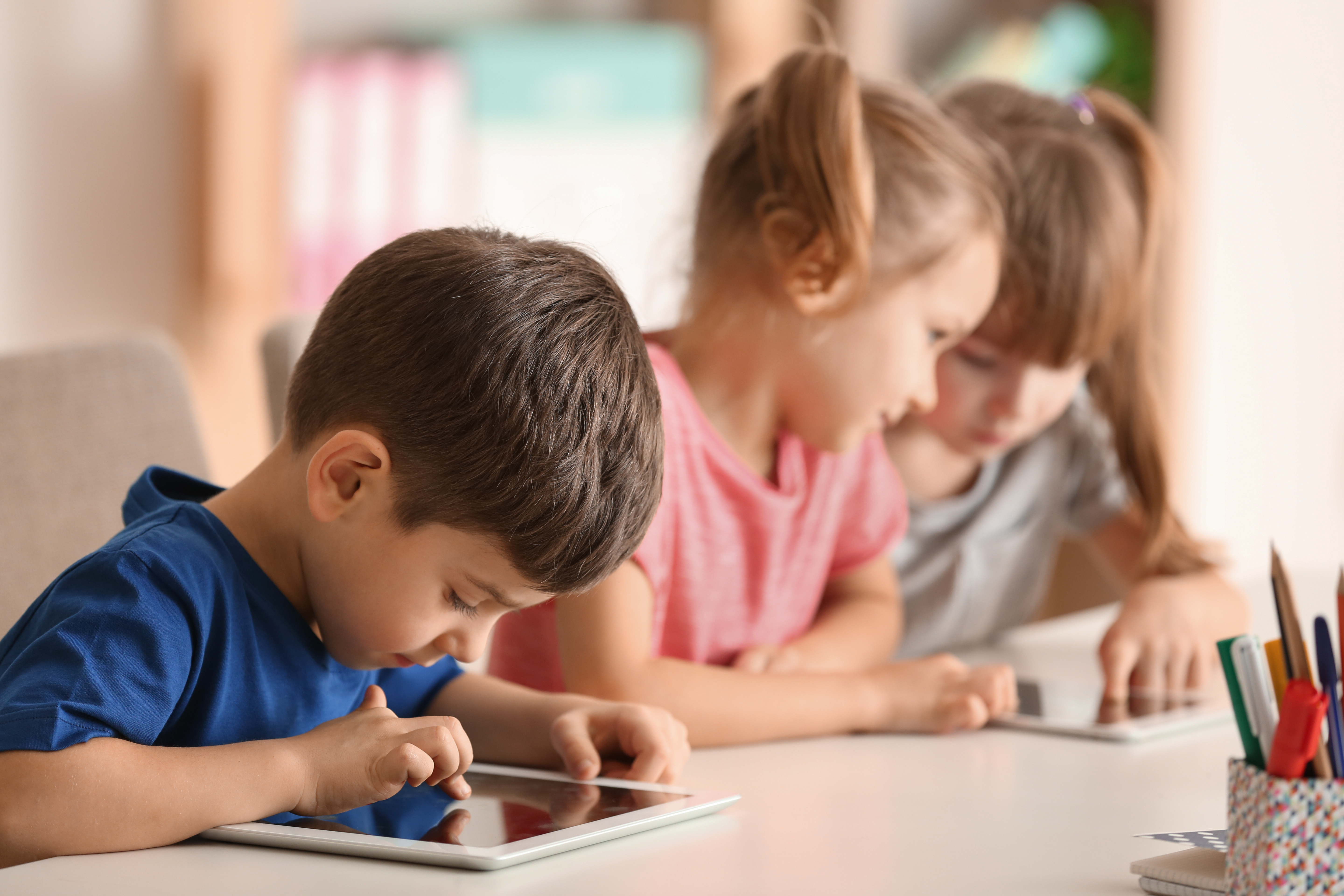 Student playing on iPad after finishing standardized test