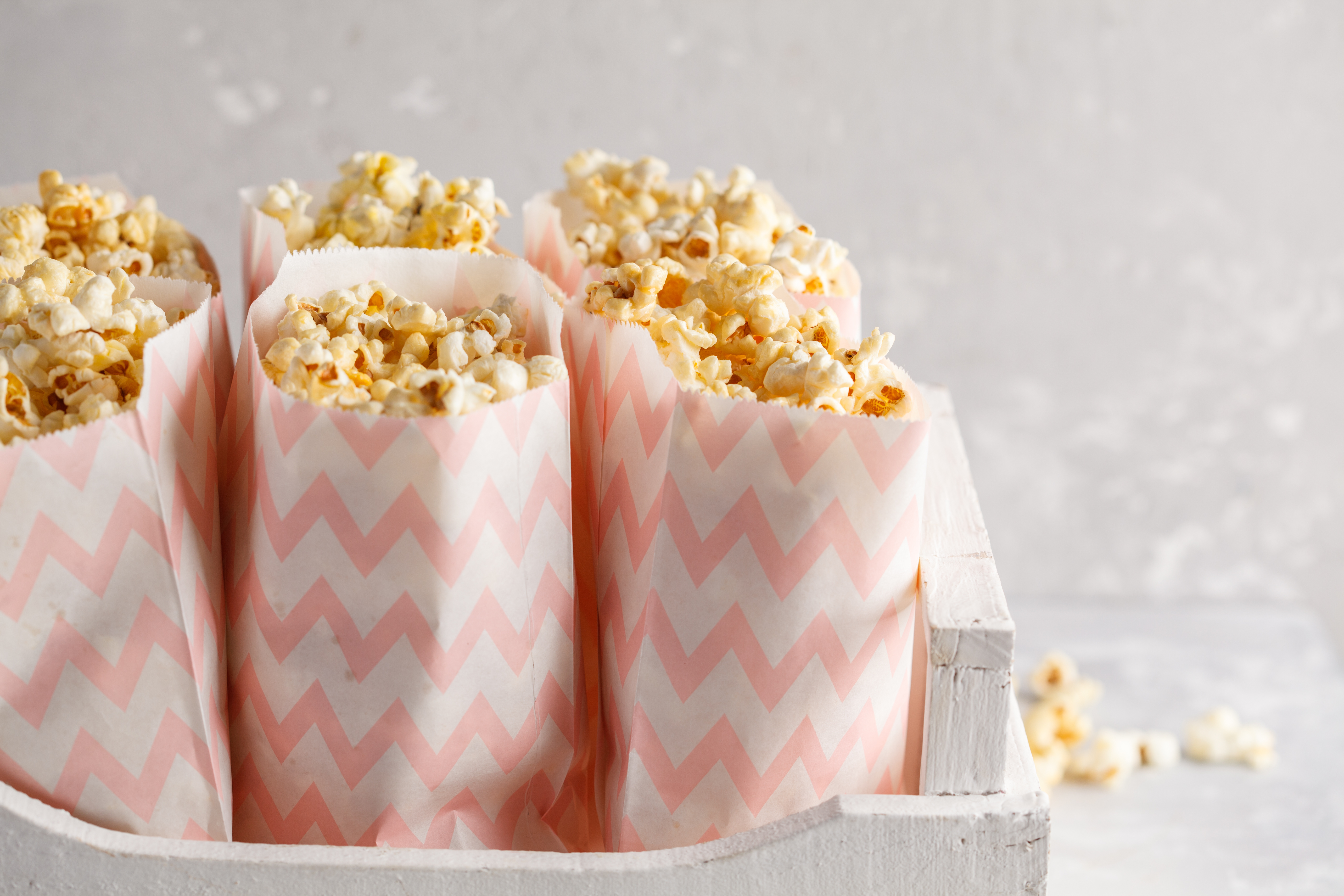 Bagged popcorn in a basket ready for students to take it after testing