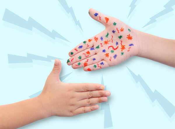 Child's hand with germs drawn on the palm with markers 