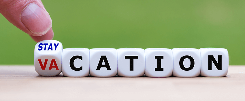 Stay-cation to Vacation spelt out in die Stay-cation to Vacation spelt out in die