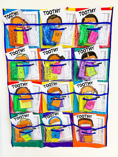 Colorful Centers Pocket Chart filled filled with children's Toothy games