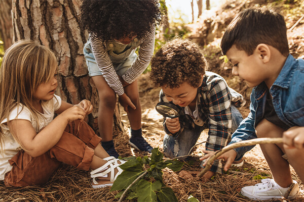 Children outside practicing learning activities during Spring Break