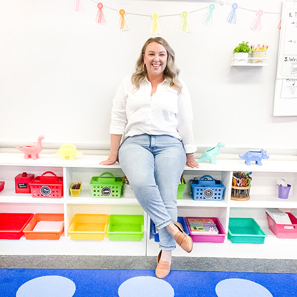 1st Grade Teacher, Bethany Barr sitting in her bright and colorful classroom 1st Grade Teacher, Bethany Barr sitting in her bright and colorful classroom