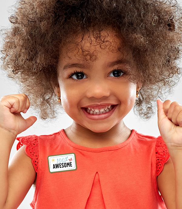 Young child excited to get 100% Awesome Sticker