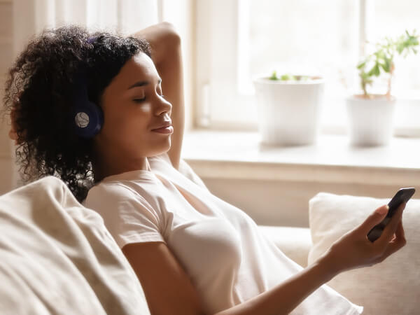 Teacher listening to music as form of relaxation