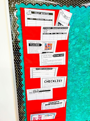 Red pocket chart filled with frequently used classroom forms and checklist