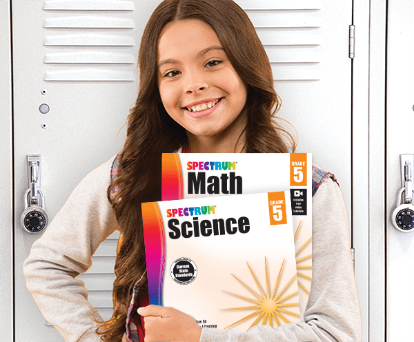 Student holding Spectrum Science and Spectrum Math Workbooks in front of school locker