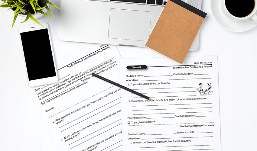 Pre-Teacher Conference Questionnaire and Conference Record on teacher desk